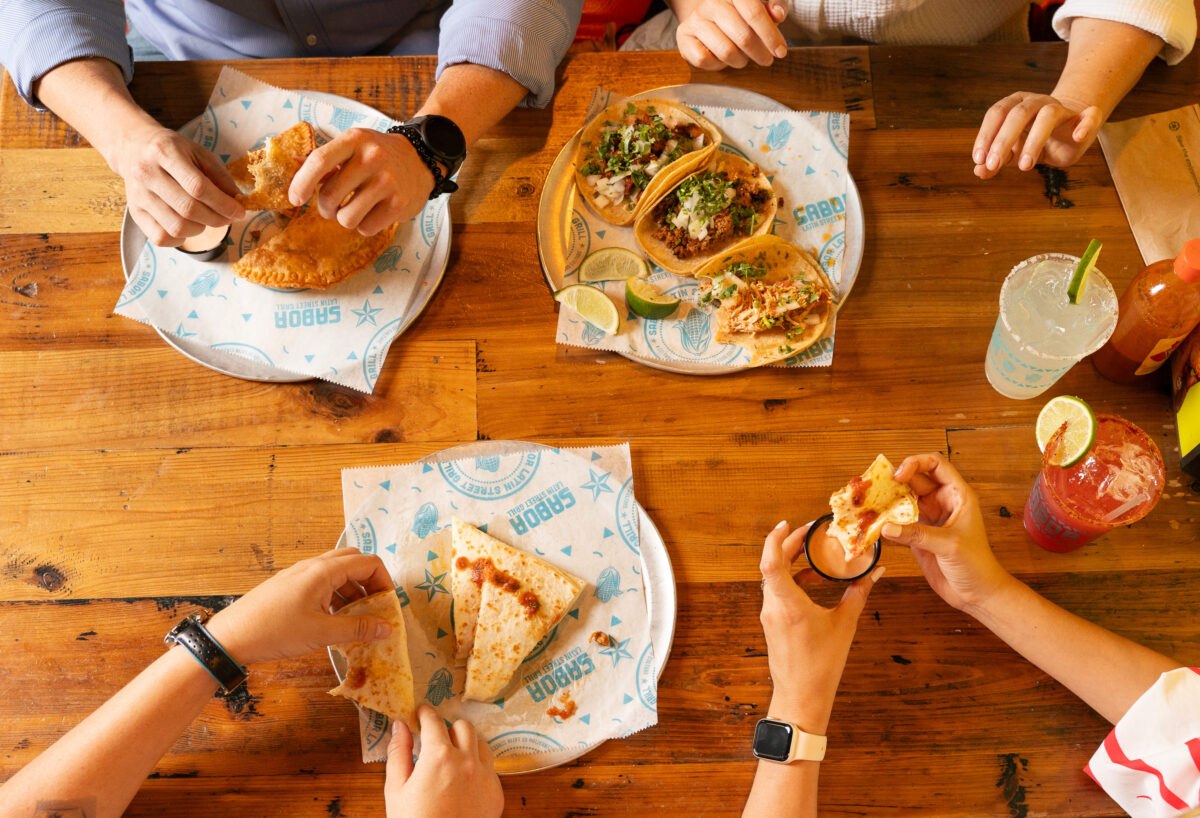 man eating latin american cuisine at Sabor Latin Street Grill