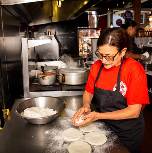 photo of Sabor employee hand-making flour tortillas
